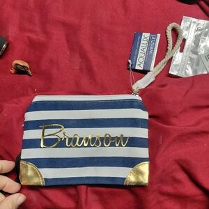 Branson Aqualux deluxe wristlet in a blue and white striped pattern with a gold